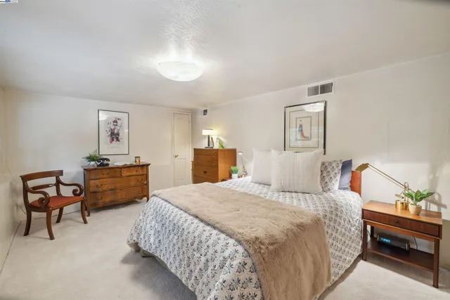 a view of a house with a yard and tree s