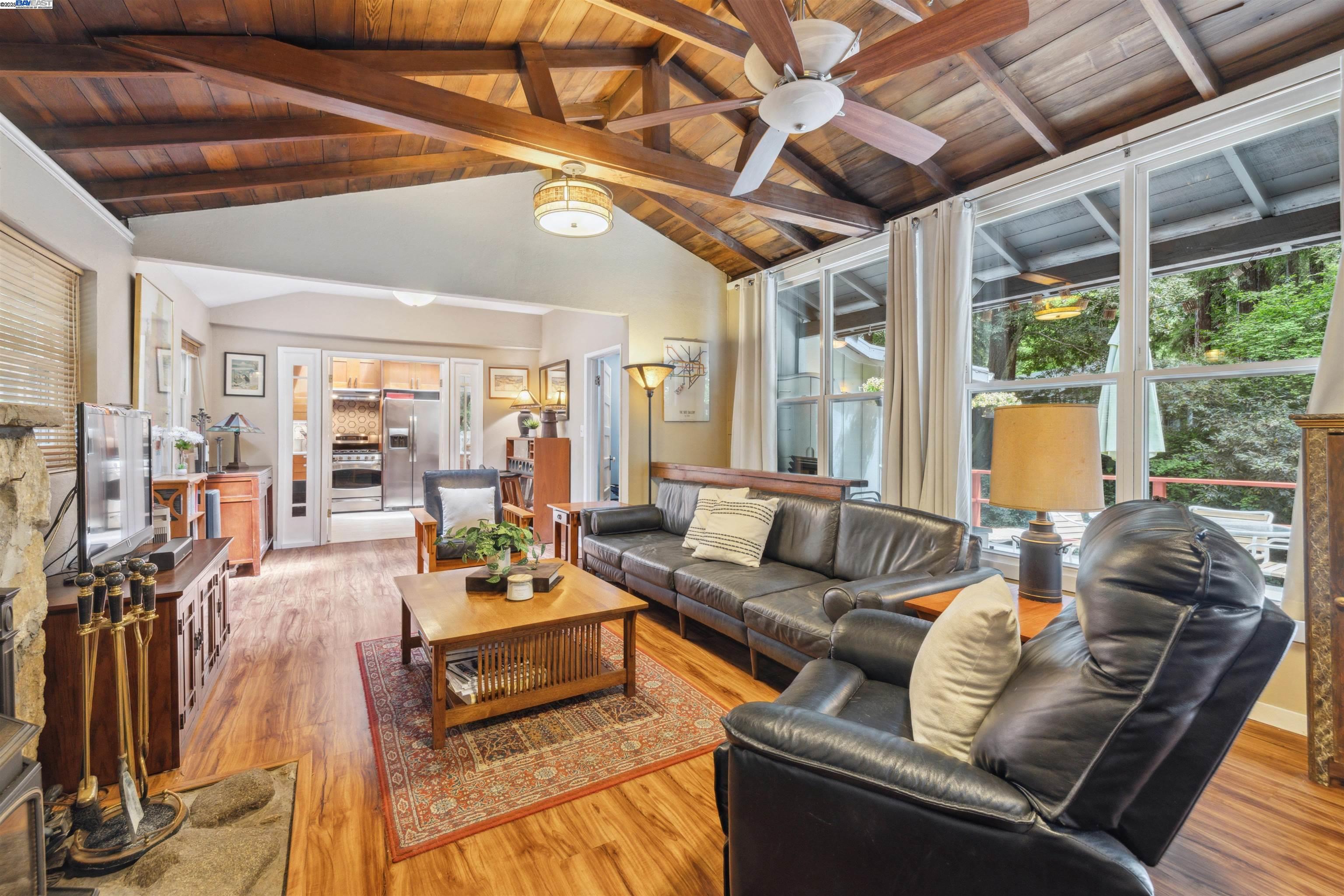 495 Primavera Road Boulder Creek, CA 95006 - Photo 3 of 33 a living room with furniture and a large window