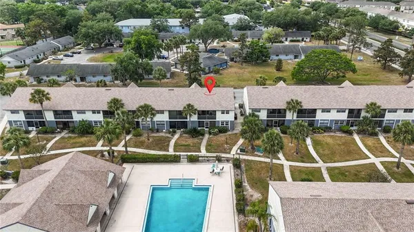 an aerial view of house with a swimming pool