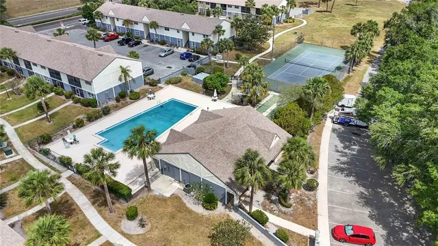 an aerial view of a house with a yard