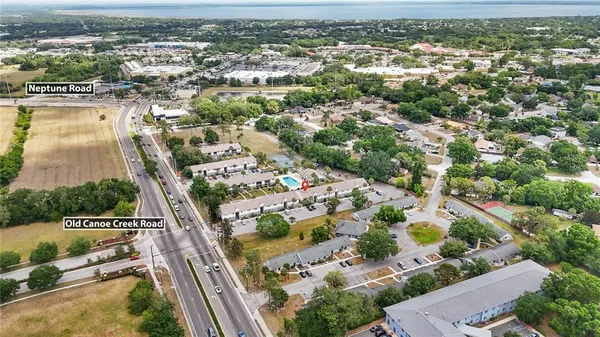 an aerial view of residential houses with outdoor space