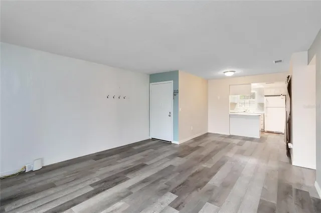 a view of an empty room with a window