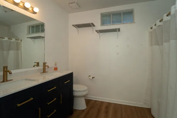 a view of a house with a yard and a palm tree