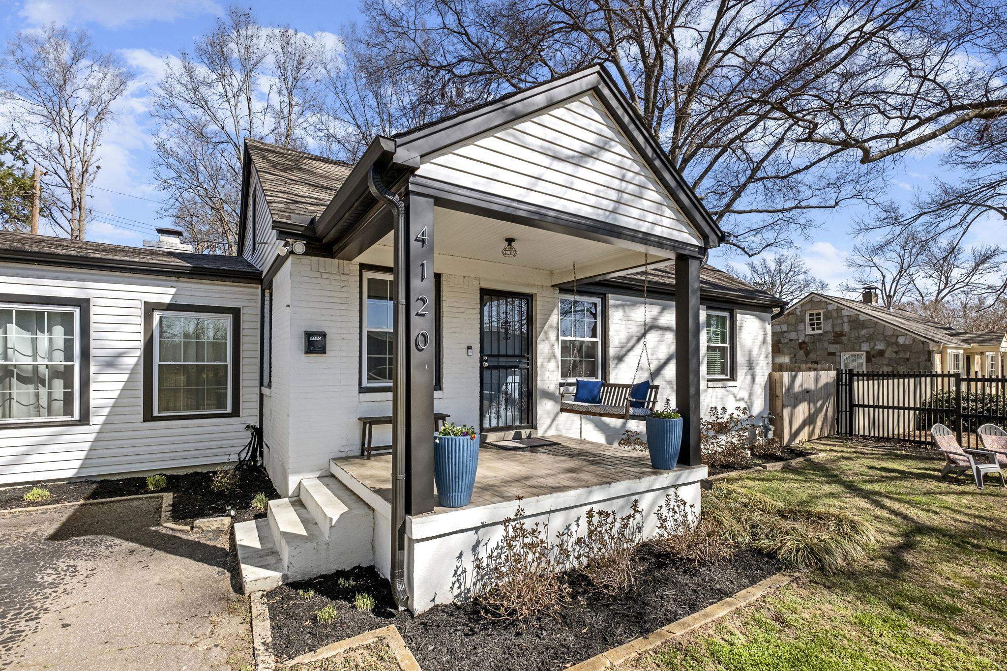 4120 Village Road Memphis, TN 38117 - Photo 1 of 28 View of front facade featuring brick siding and a porch