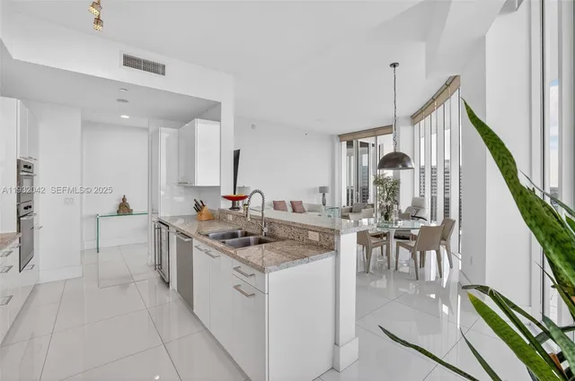 a kitchen with sink cabinets and outdoor seating