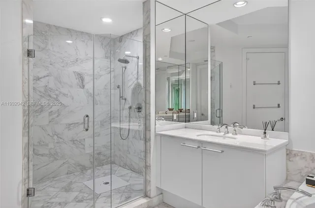 a bathroom with a bathtub and a sink