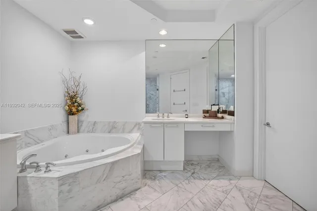 a view of room with bed and furniture