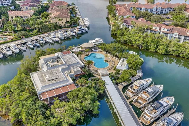 a dining room with furniture and a potted plant