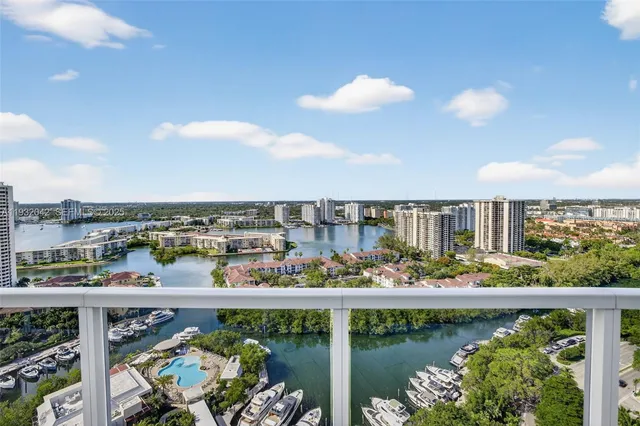 a view of a livingroom with furniture and a kitchen