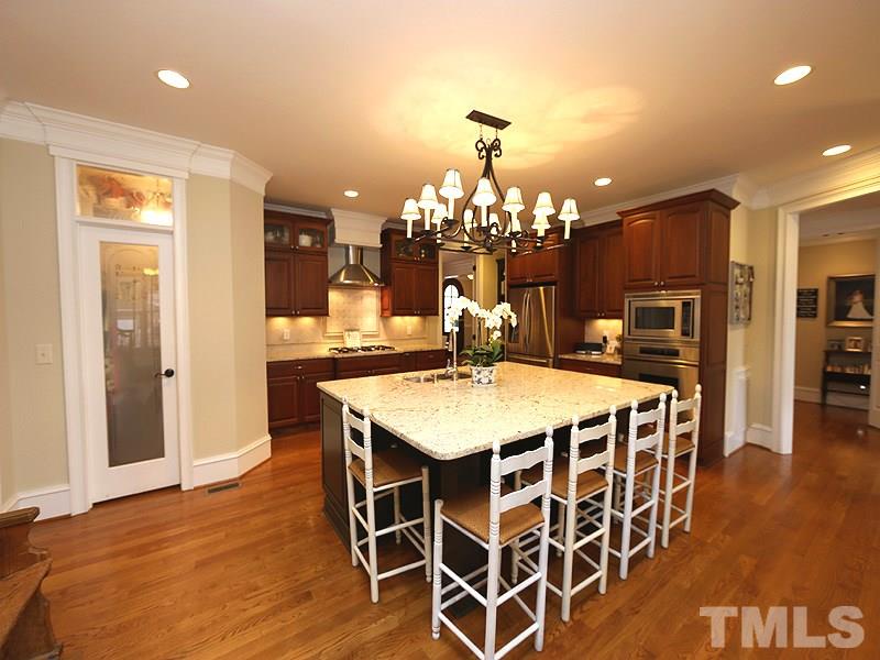 1420 Duplin Road Raleigh, NC 27607 - Photo 11 of 25 a view of a dining room with furniture and wooden floor