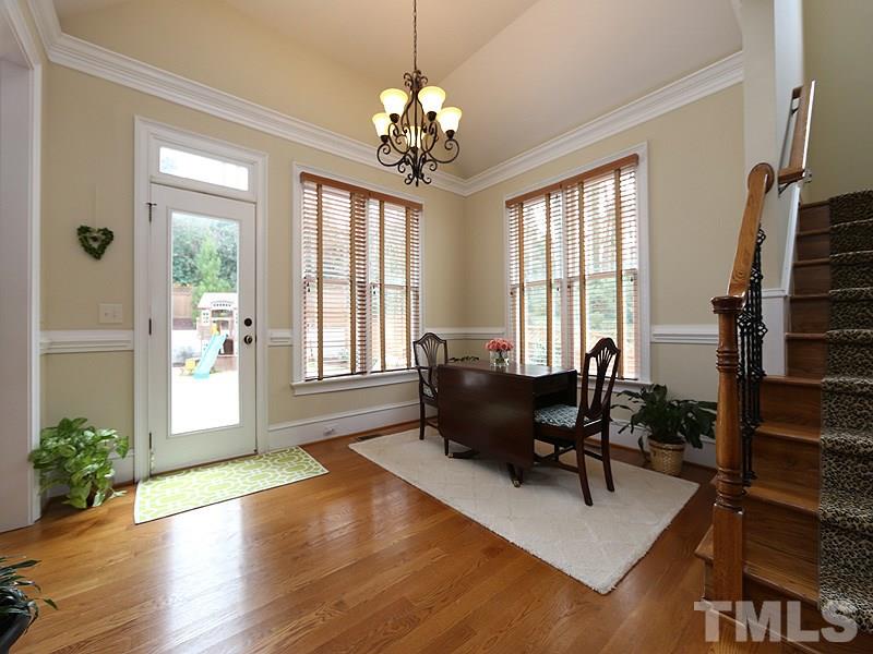 1420 Duplin Road Raleigh, NC 27607 - Photo 13 of 25 a living room with furniture and a chandelier