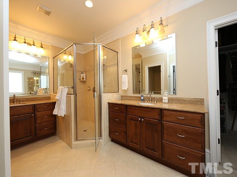 1420 Duplin Road Raleigh, NC 27607 - Photo 15 of 25 a bathroom with a granite countertop sink mirror and a shower