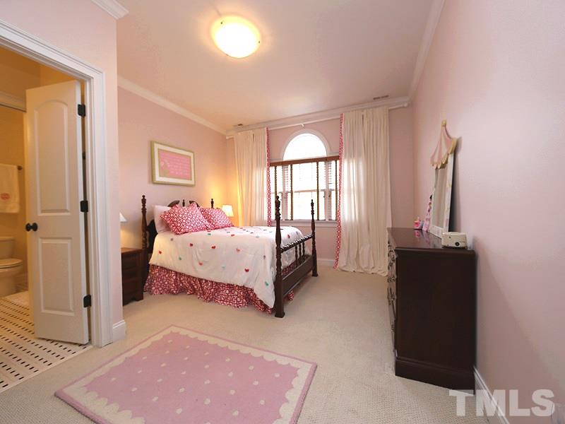 1420 Duplin Road Raleigh, NC 27607 - Photo 19 of 25 a bedroom with a bed and a window