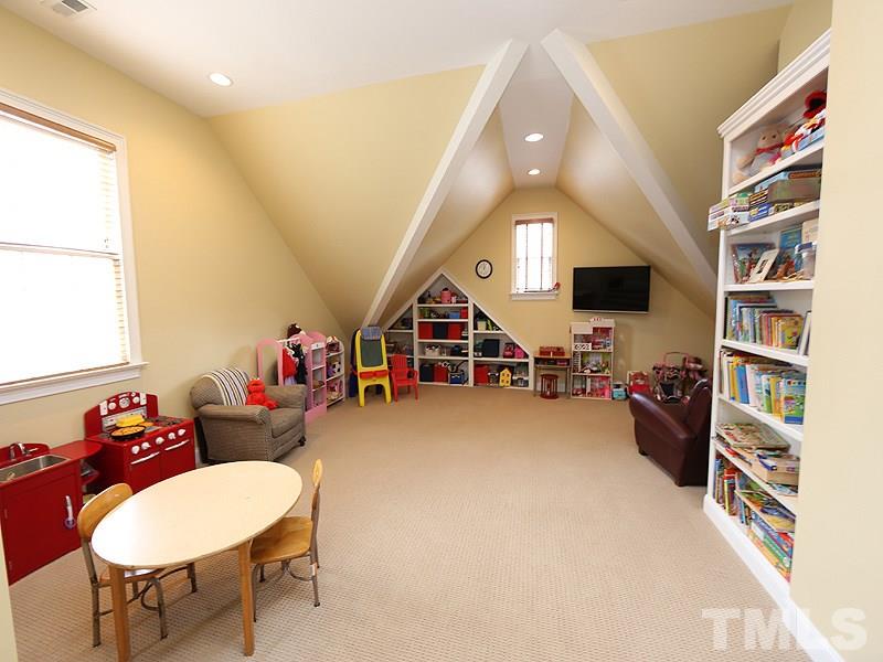 1420 Duplin Road Raleigh, NC 27607 - Photo 22 of 25 a living room with furniture and a flat screen tv