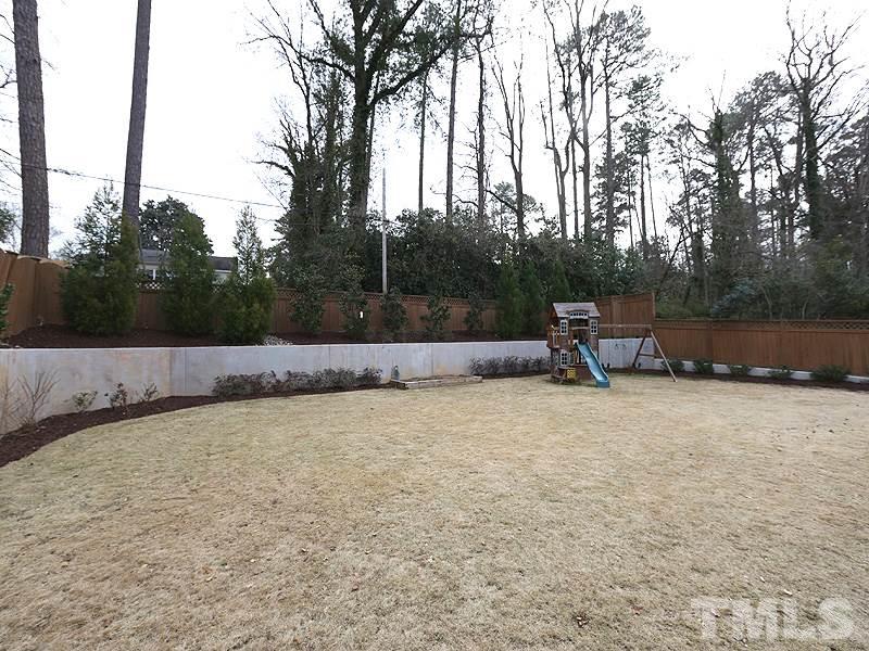 1420 Duplin Road Raleigh, NC 27607 - Photo 24 of 25 a backyard of a house with lots of green space