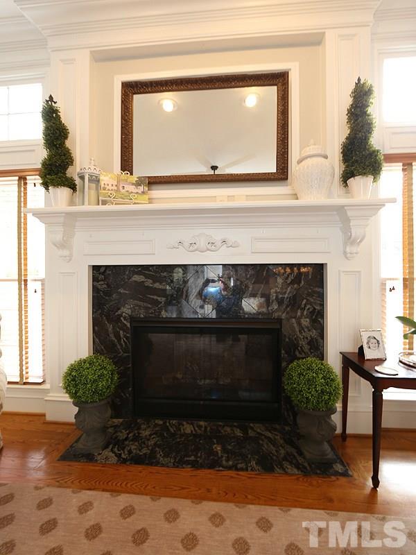 1420 Duplin Road Raleigh, NC 27607 - Photo 10 of 25 a living room with furniture and a fireplace