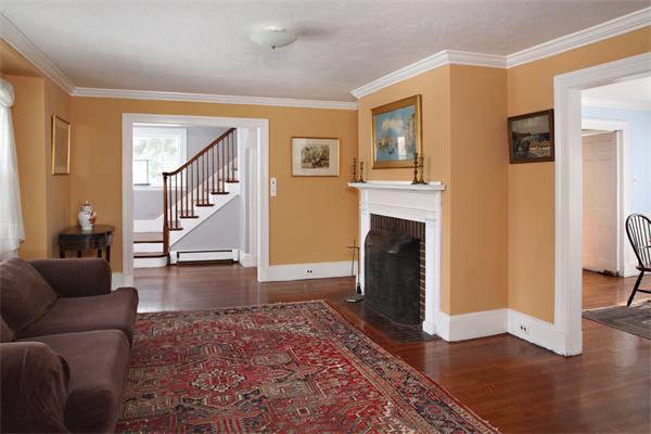 209 Boston Post Road Wayland, MA 01778 - Photo 3 of 6 a living room with furniture and a fireplace