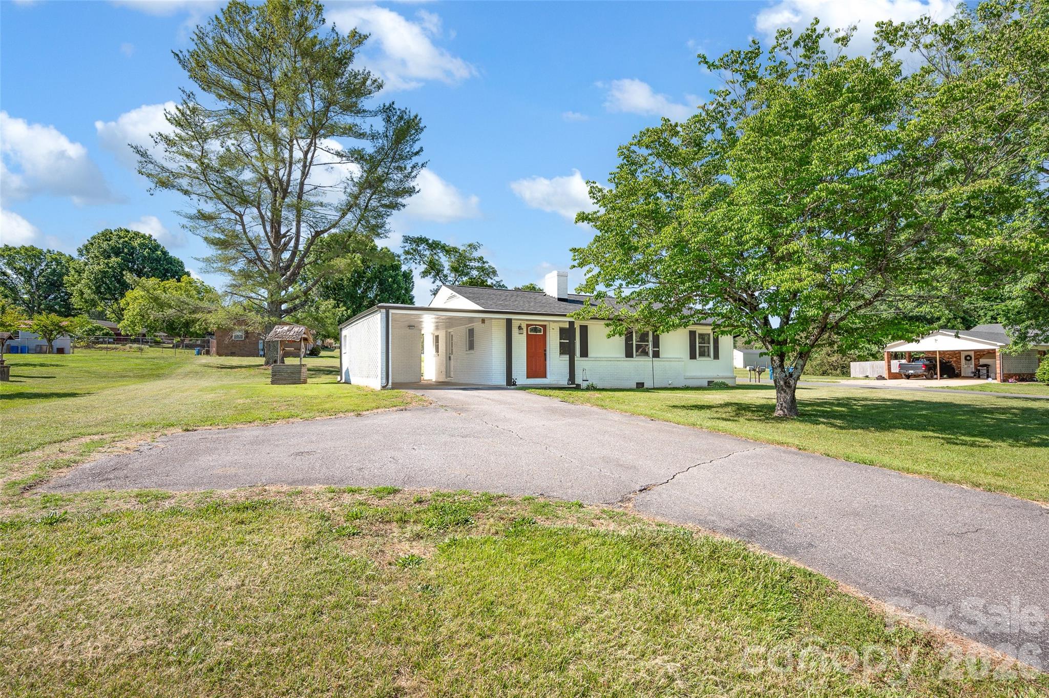 3033 West Highway 10 Conover, NC 28613 - Photo 2 of 26 a front view of a house with a yard