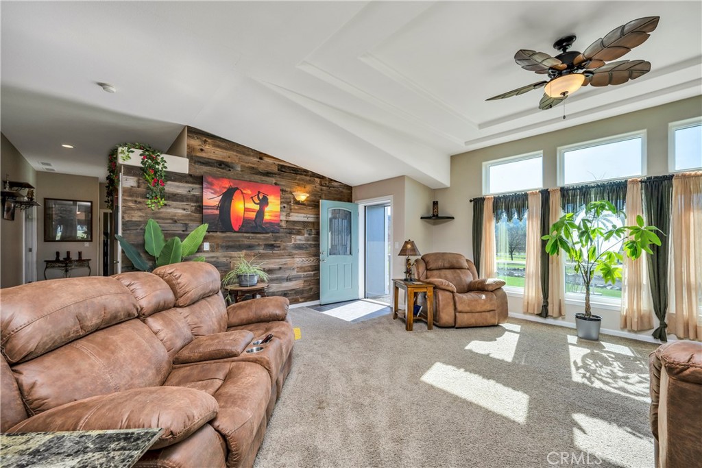 17432 Sendero Way Lower Lake, CA 95457 - Photo 13 of 65 a living room with furniture a chandelier and a flat screen tv