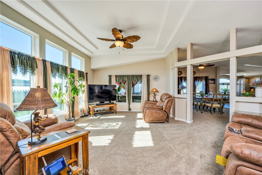 17432 Sendero Way Lower Lake, CA 95457 - Photo 14 of 65 a living room with furniture a flat screen tv and a large window