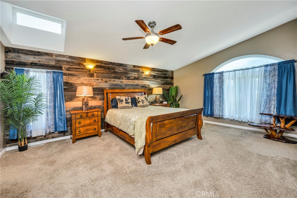 17432 Sendero Way Lower Lake, CA 95457 - Photo 18 of 65 a bedroom with a bed and a table with potted plants