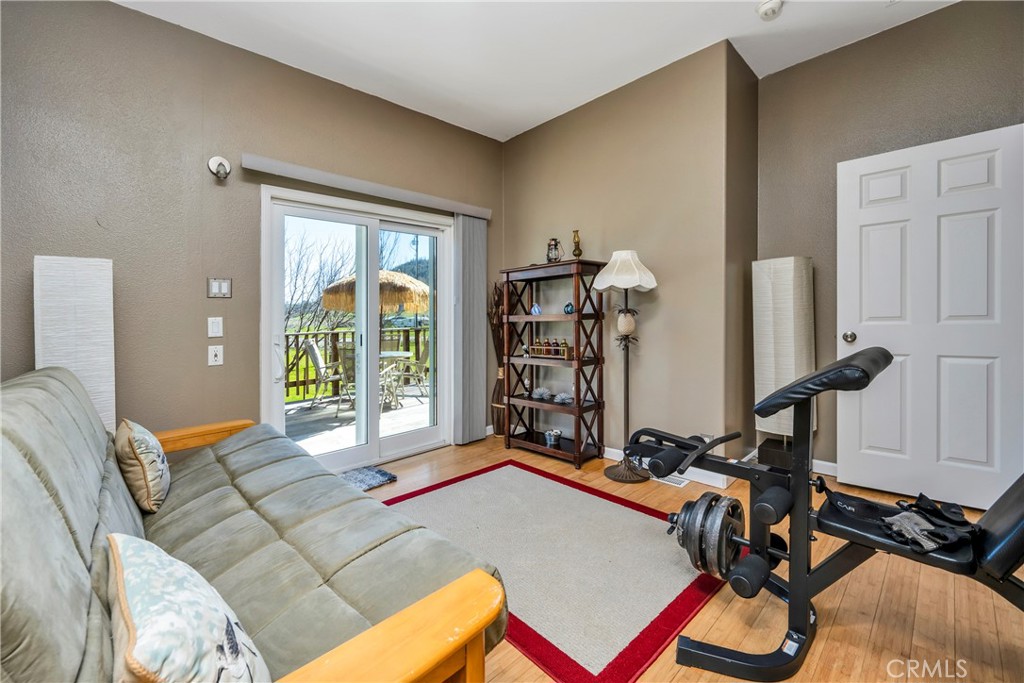 17432 Sendero Way Lower Lake, CA 95457 - Photo 19 of 65 a bedroom with furniture and a large window