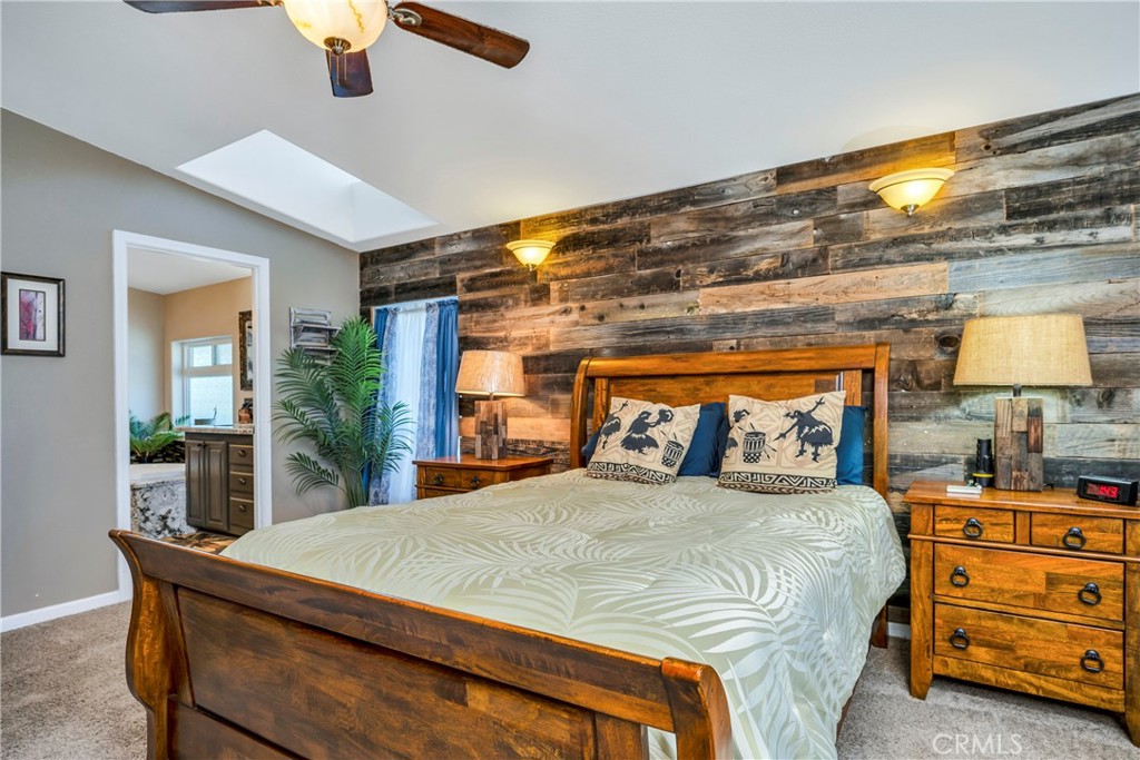 17432 Sendero Way Lower Lake, CA 95457 - Photo 20 of 65 a bedroom with a bed and a large mirror on the dresser