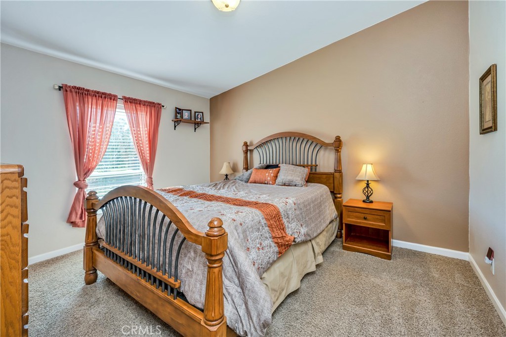 17432 Sendero Way Lower Lake, CA 95457 - Photo 27 of 65 a bedroom with a bed and window
