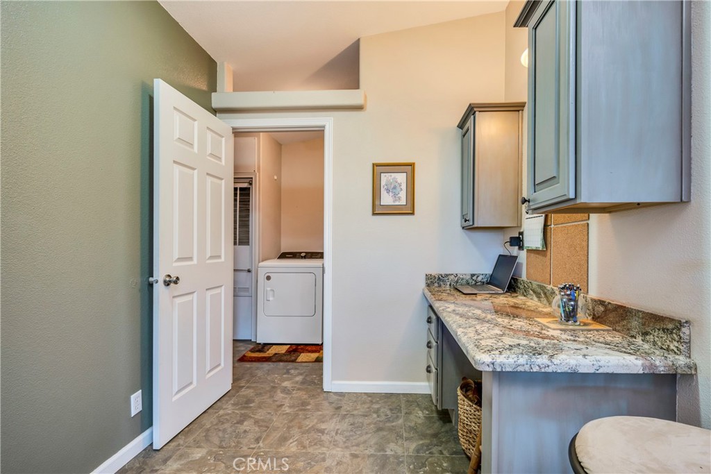 17432 Sendero Way Lower Lake, CA 95457 - Photo 29 of 65 a kitchen with a granite countertop sink and cabinets