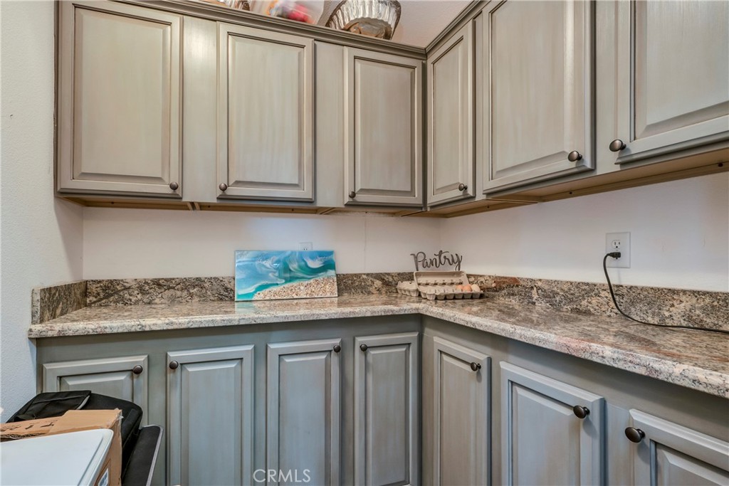 17432 Sendero Way Lower Lake, CA 95457 - Photo 31 of 65 a kitchen with granite countertop stainless steel appliances white cabinets sink and a granite counter top