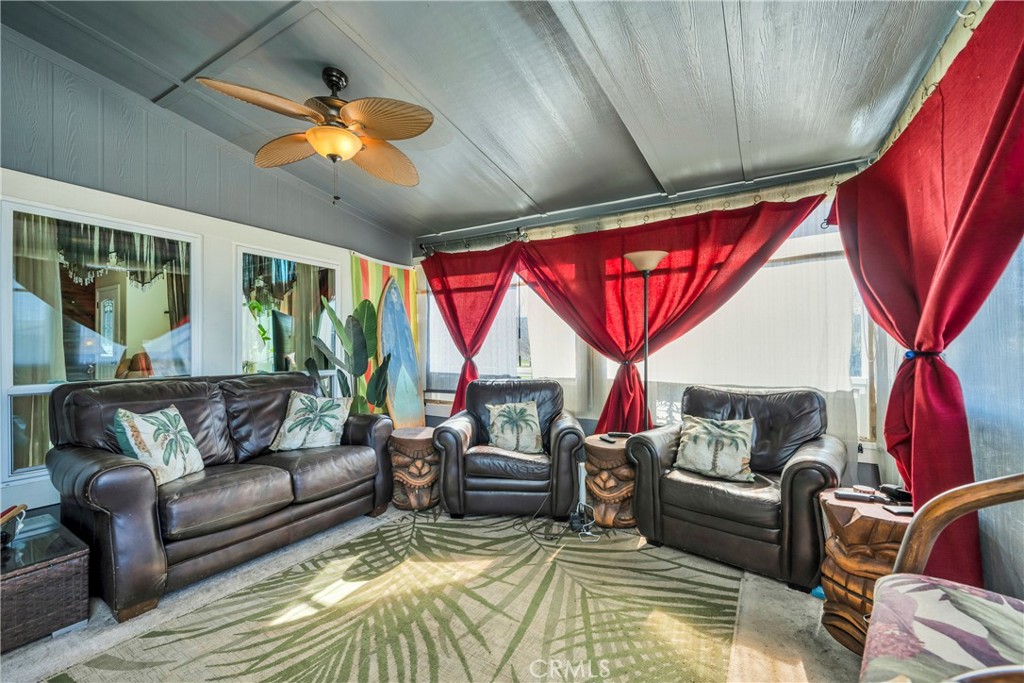 17432 Sendero Way Lower Lake, CA 95457 - Photo 33 of 65 a living room with furniture a rug and a chandelier