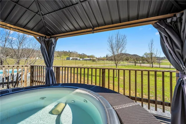 a view of swimming pool with outdoor seating and plants