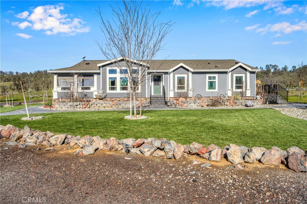 17432 Sendero Way Lower Lake, CA 95457 - Photo 58 of 65 a front view of a house with a yard table and chairs