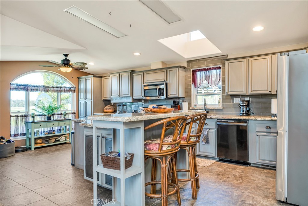 17432 Sendero Way Lower Lake, CA 95457 - Photo 9 of 65 a kitchen with stainless steel appliances granite countertop a stove and a refrigerator