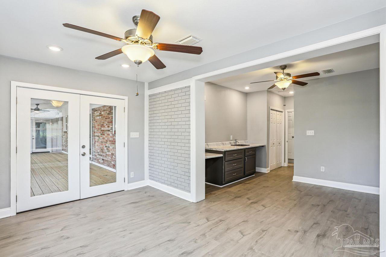 4900 Shell Road Milton, FL 32583 - Photo 30 of 52 a view of an empty room with a kitchen