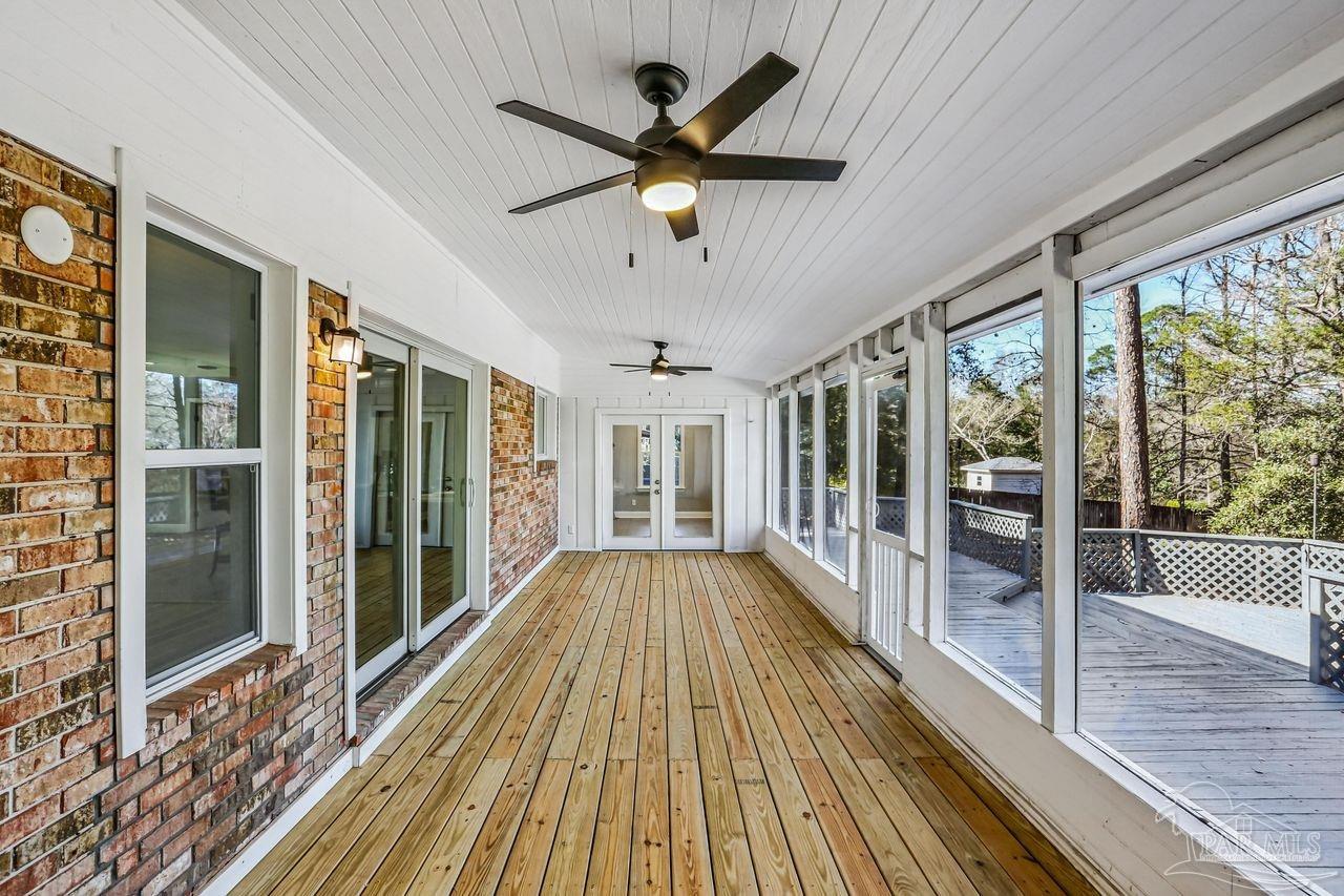 4900 Shell Road Milton, FL 32583 - Photo 36 of 52 a view of a livingroom with wooden floor and a ceiling fan