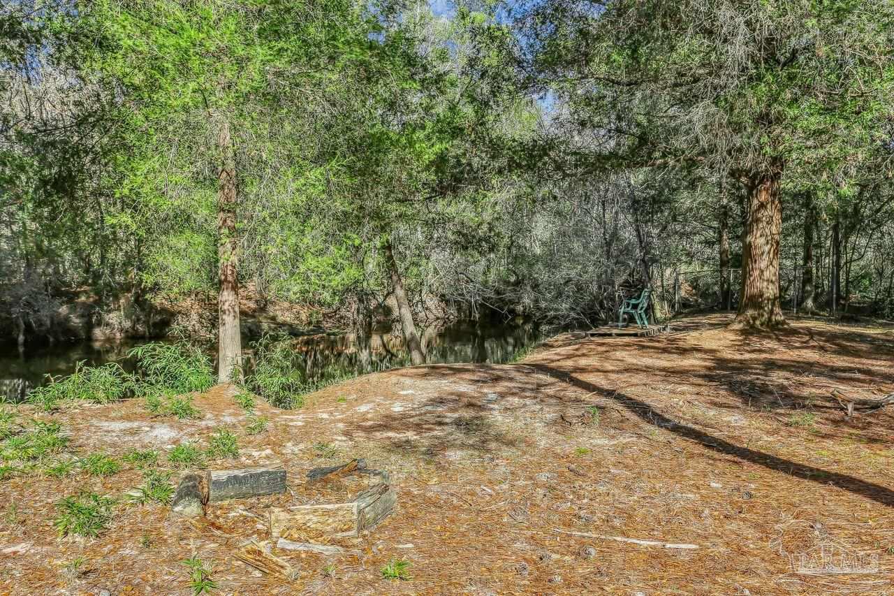 4900 Shell Road Milton, FL 32583 - Photo 44 of 52 a view of backyard space and trees
