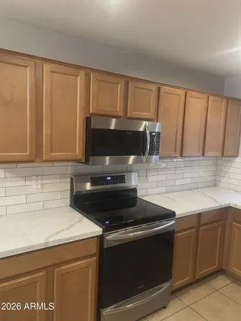 a kitchen with a sink and a microwave