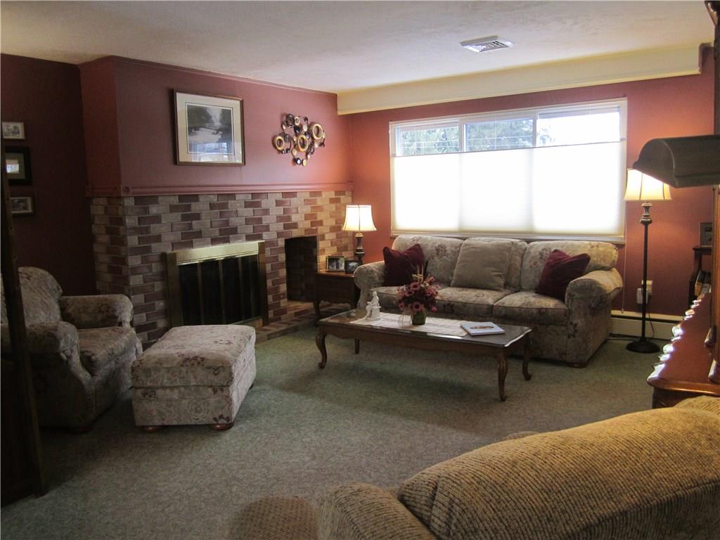 203 Murrysville Road Level Green, PA 15085 - Photo 3 of 24 Cozy and welcoming the living room is open into the dining room.