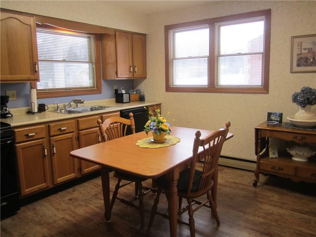 203 Murrysville Road Level Green, PA 15085 - Photo 4 of 24 Lots of natural light in this eat-in-kitchen. All appliances convey. Side door to yard is also located here. Double bowl stainless sink, new laminate wood look flooring, lots of cabinet space.