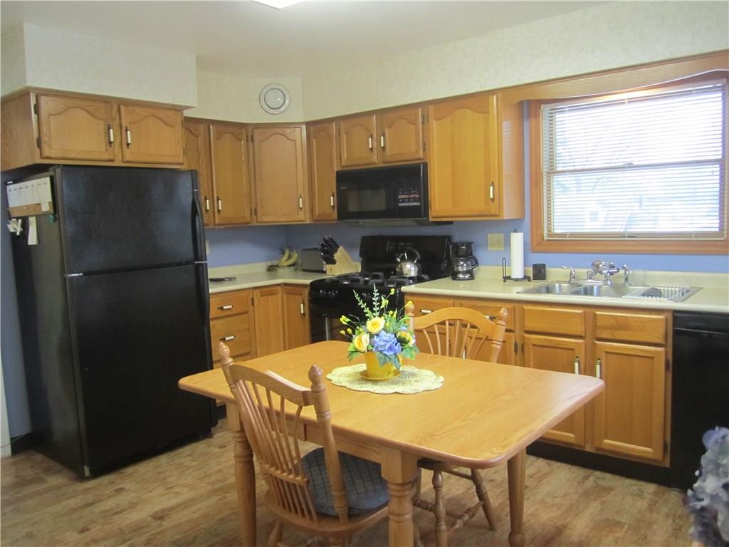 203 Murrysville Road Level Green, PA 15085 - Photo 5 of 24 Room for a table or island, dishwasher, gas stove, microwave and refrigerator all convey. 3rd bedroom currently used as an office is located conveniently off this room.