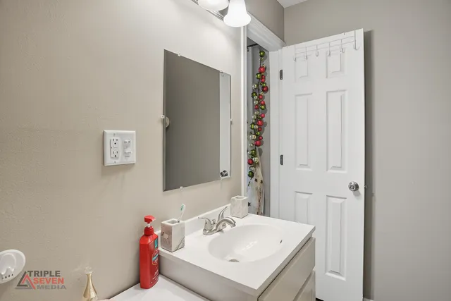 a bathroom with a sink and a mirror