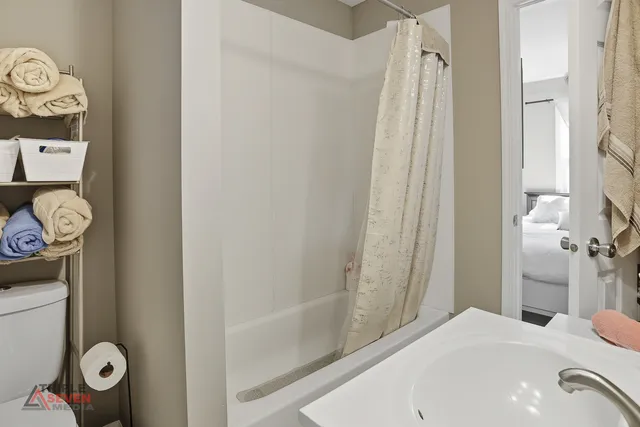 a bathroom with a bathtub and a shower