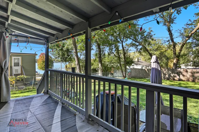 a view of a two chairs in the balcony