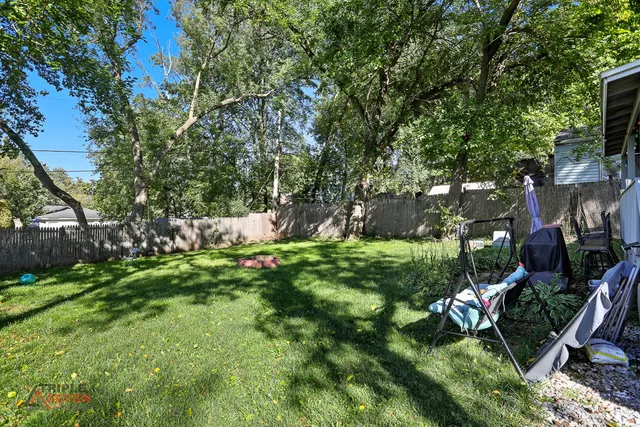 a view of a house with a yard porch and sitting area