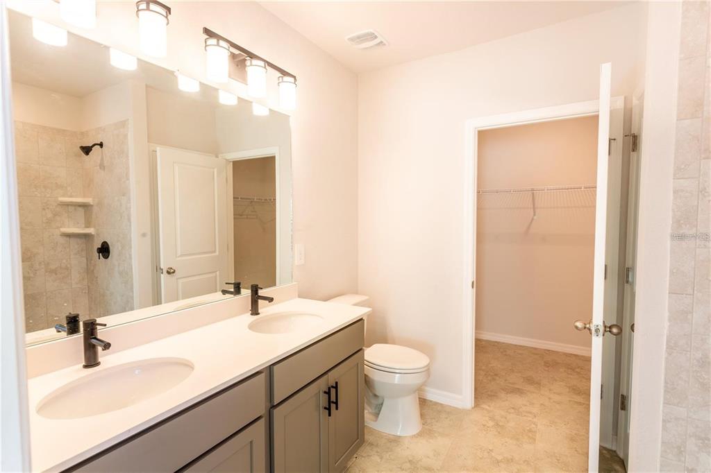 133 Angol Street Punta Gorda, FL 33983 - Photo 13 of 34 a bathroom with a sink a toilet and shower