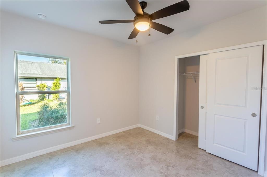 133 Angol Street Punta Gorda, FL 33983 - Photo 21 of 34 an empty room with a window and a fan