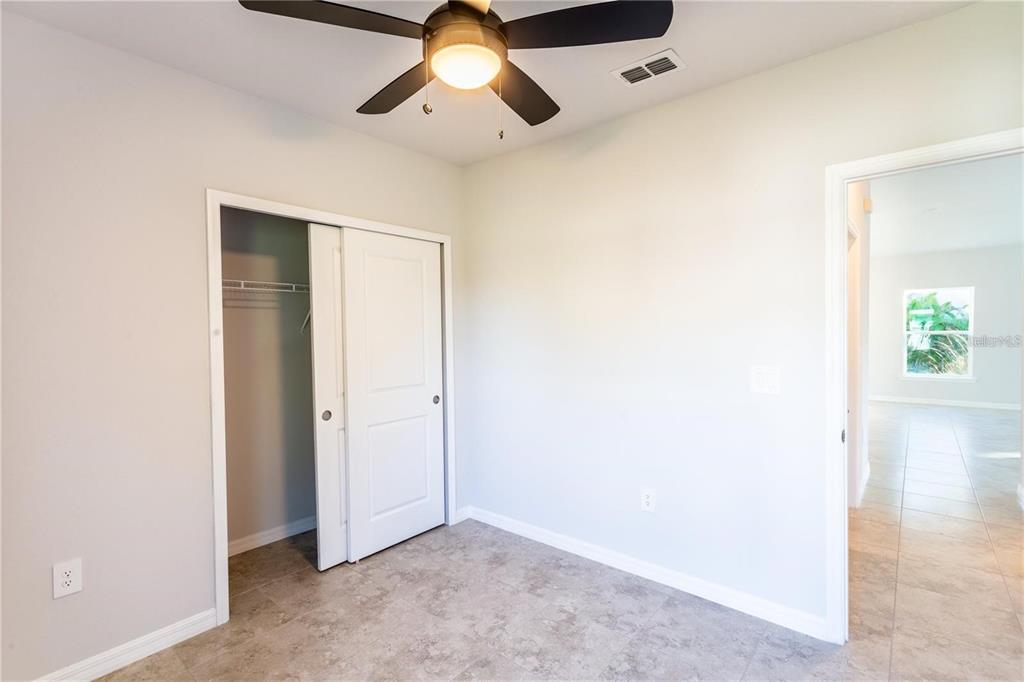 133 Angol Street Punta Gorda, FL 33983 - Photo 22 of 34 an empty room with window and ceiling fan