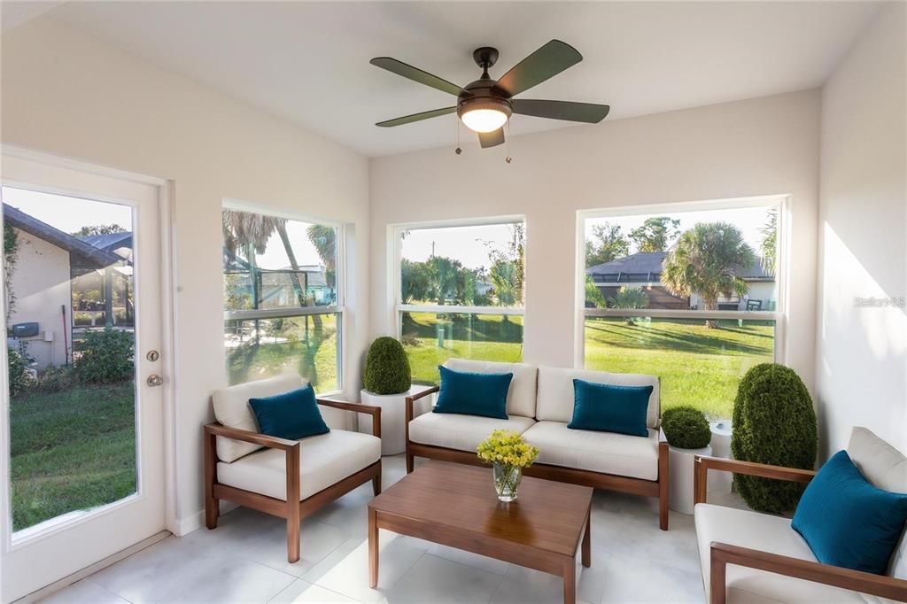 133 Angol Street Punta Gorda, FL 33983 - Photo 27 of 34 a living room with furniture and a large window