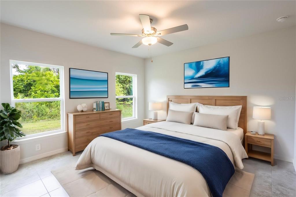 133 Angol Street Punta Gorda, FL 33983 - Photo 28 of 34 a bedroom with a bed and a window